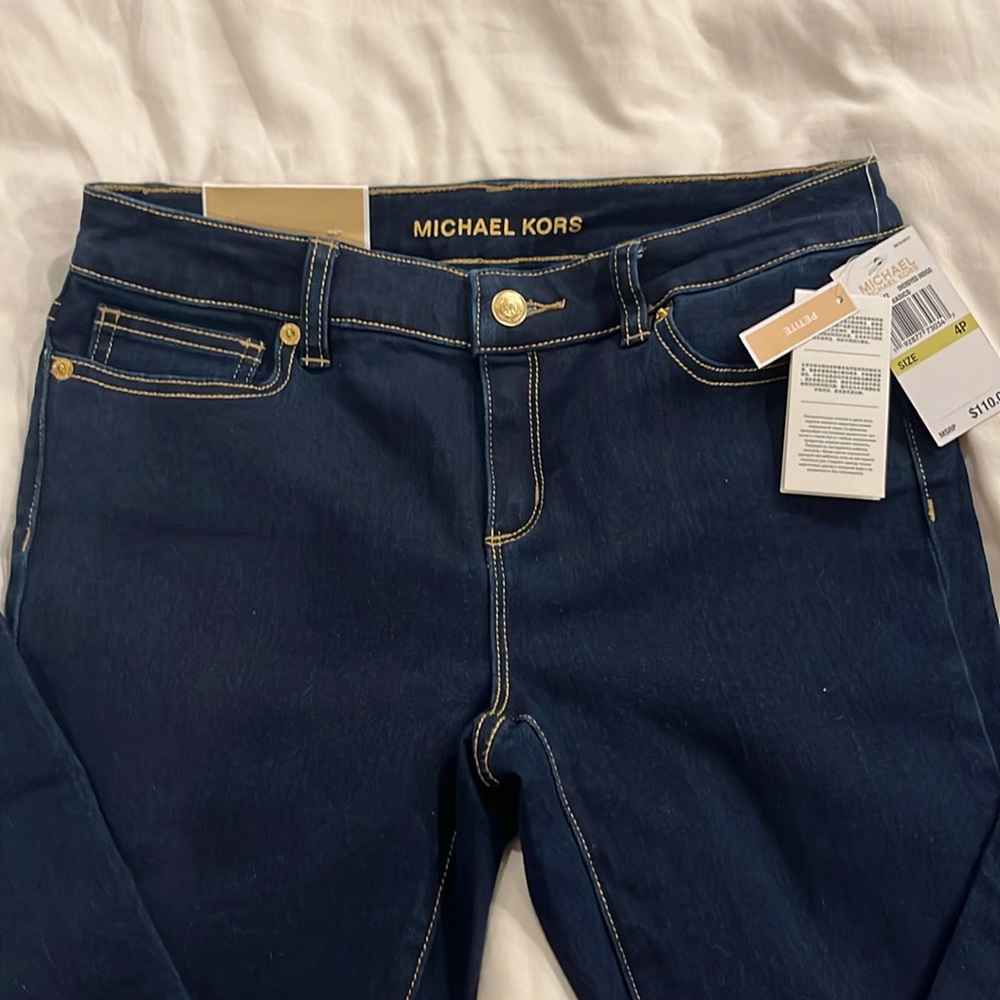 Mid rise MK jeans.